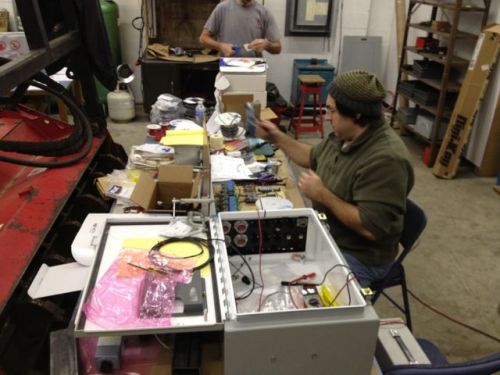 Dean - the electronics guru - working on in the Ebox.